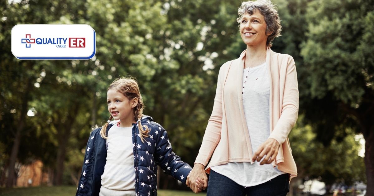 grandma walking outdoors with her grandaughter